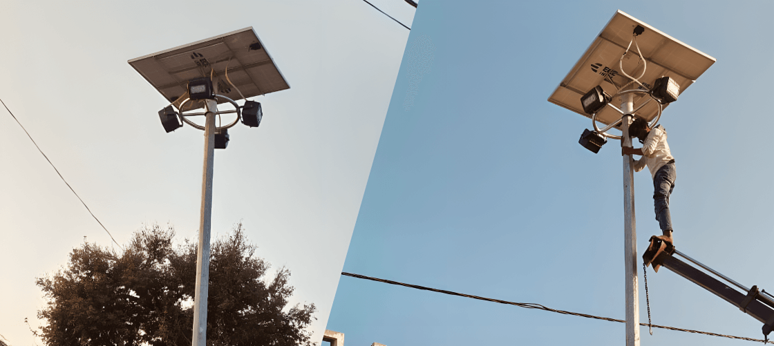 Workers installing a street light